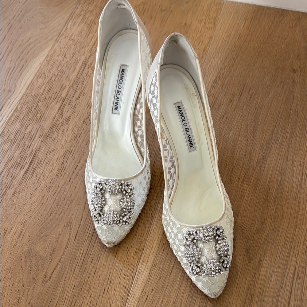 Manolo Blahnik Ivory Lace Pointed Toe Pumps with Crystal Buckles. Bridal
